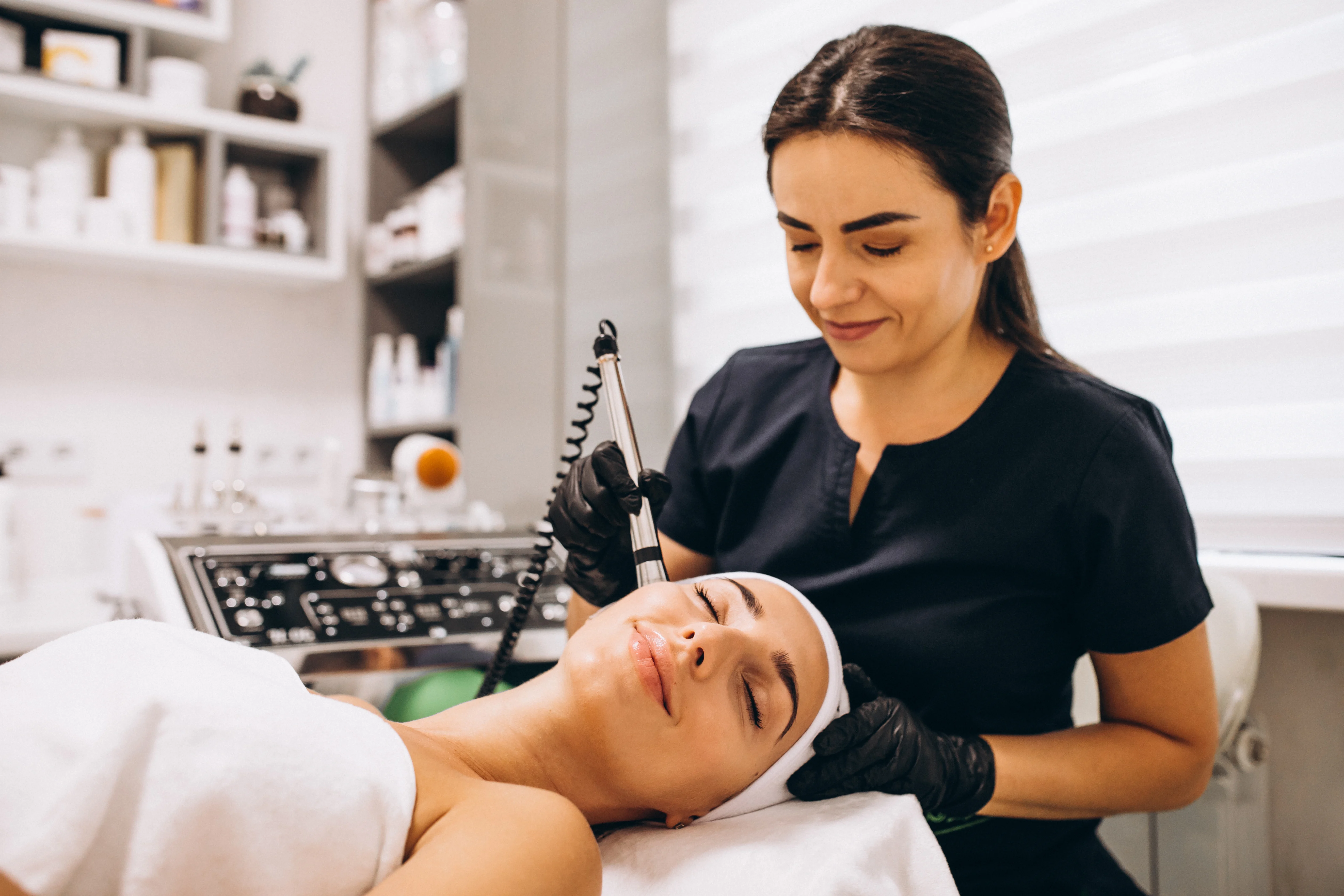 Spa owner making treatment to one of her clients